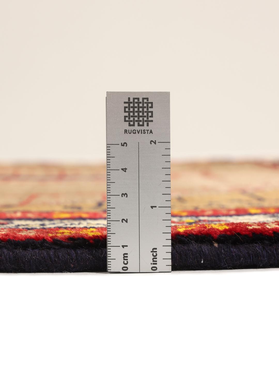 Hand-knotted Ghashghai rug from the Middle East with a brown field and geometric patterns