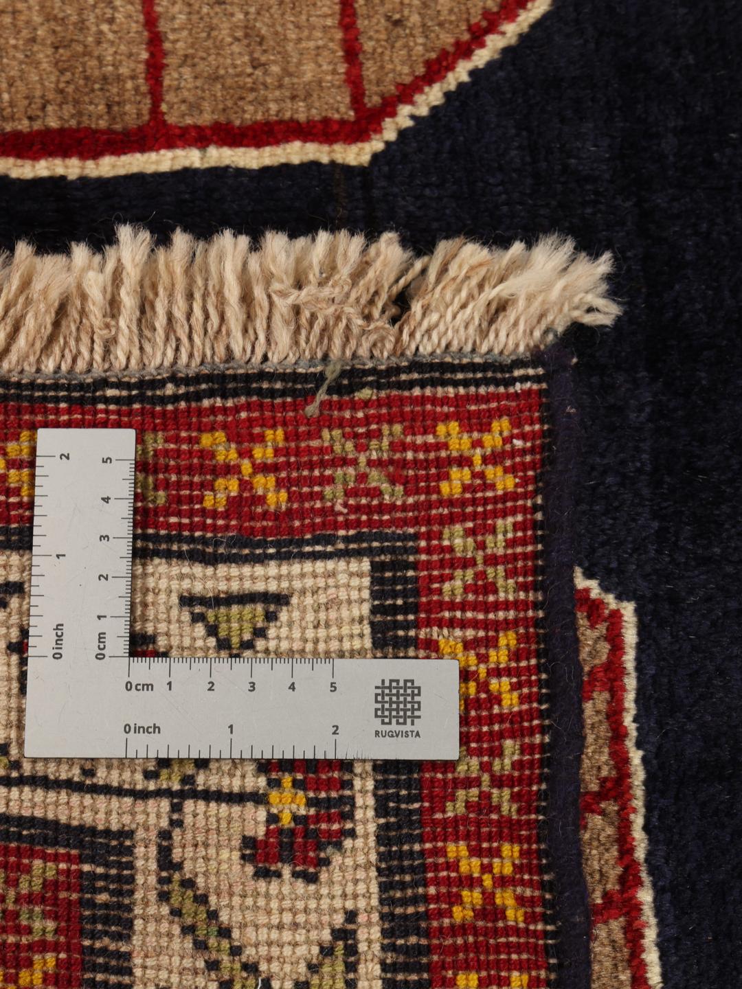 Hand-knotted Ghashghai rug from the Middle East with a brown field and geometric patterns