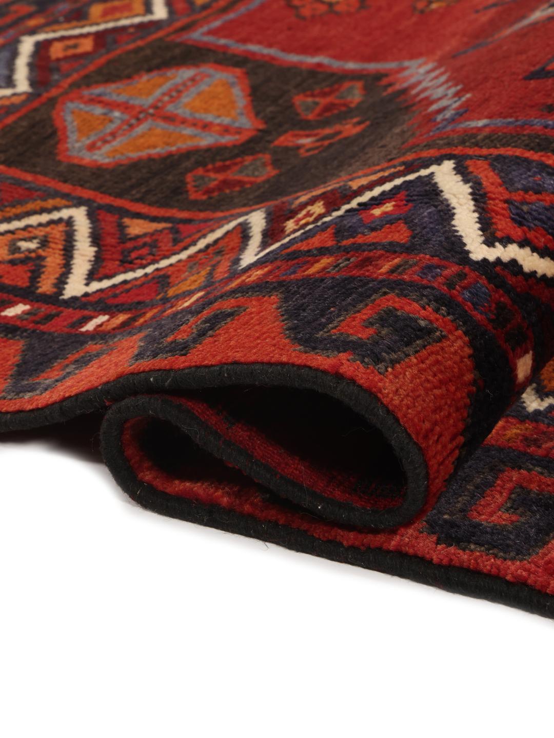 Hand-knotted Lori rug with red and black geometric tribal patterns from the Middle East