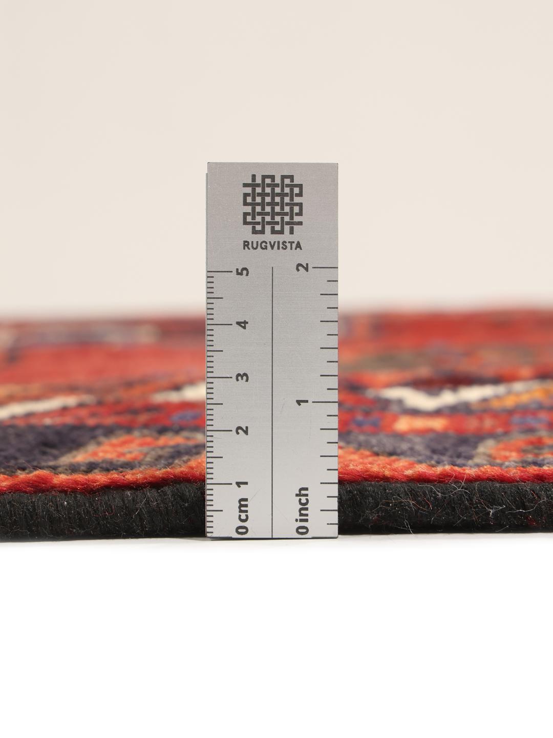 Hand-knotted Lori rug with red and black geometric tribal patterns from the Middle East