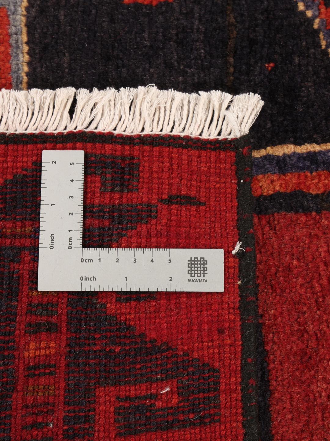 Hand-knotted Lori rug with red and black geometric tribal patterns from the Middle East