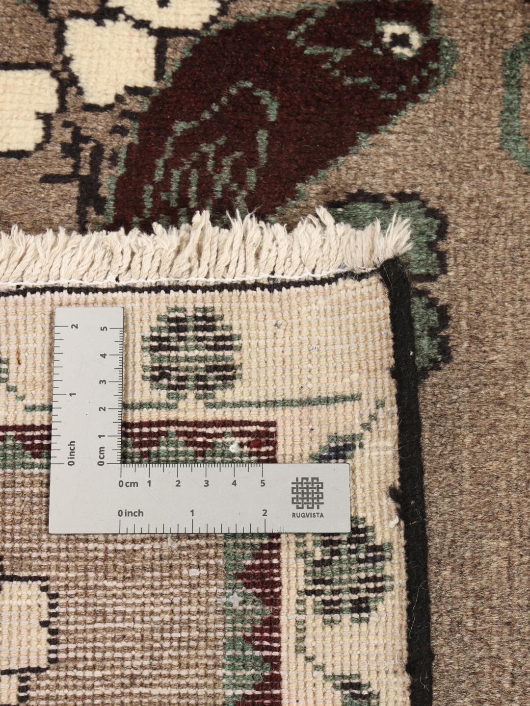 Hand-knotted Qashqai rug with bird and floral patterns in brown tones