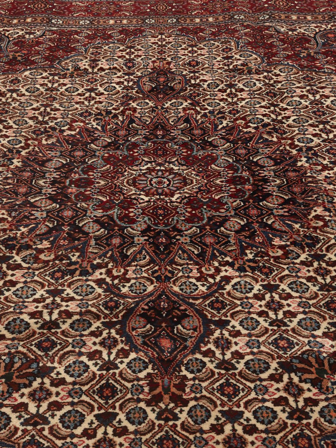 A one-of-a-kind hand-knotted Moud rug in dark-red and beige with an ornate floral medallion pattern.