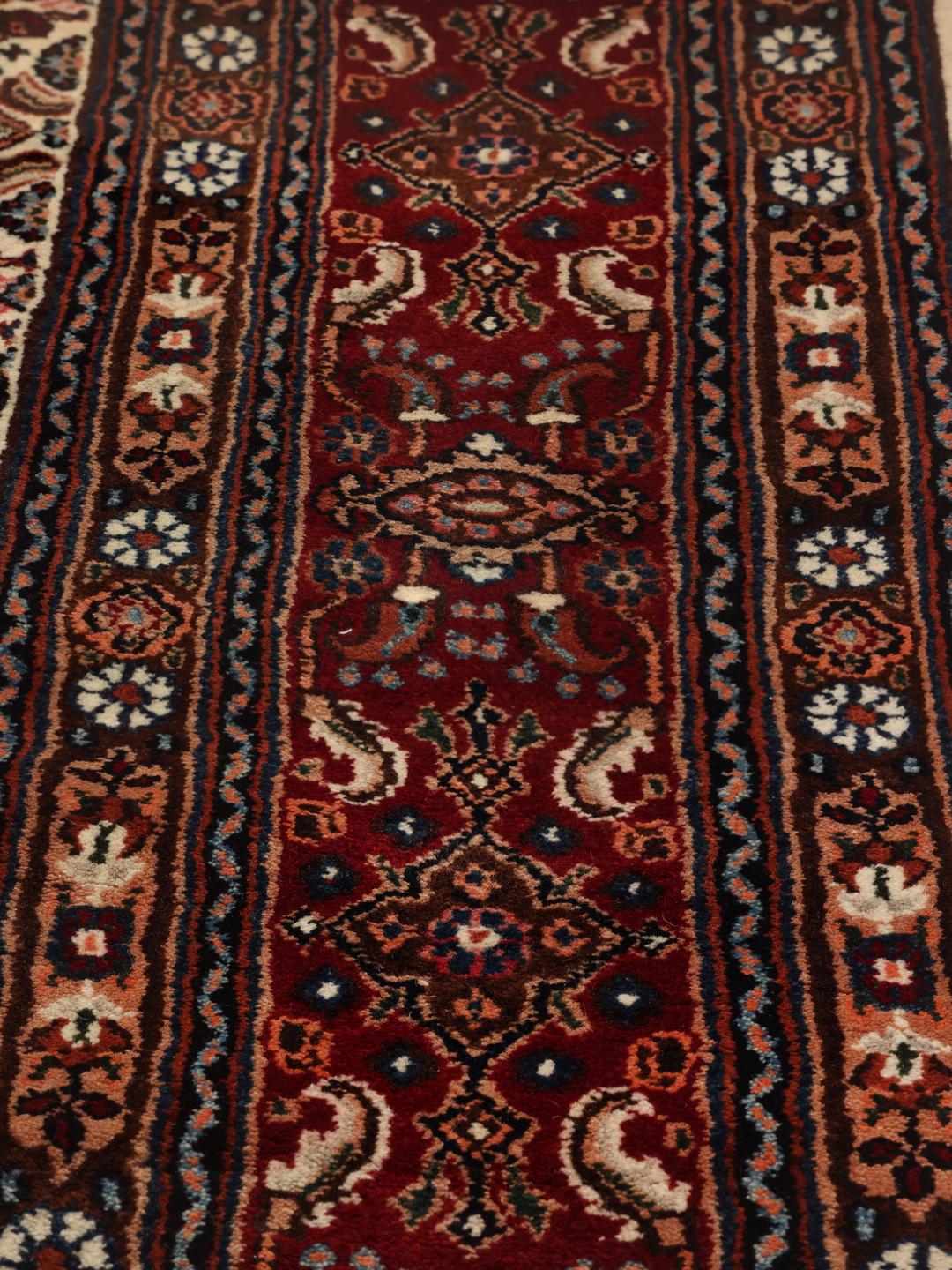 A one-of-a-kind hand-knotted Moud rug in dark-red and beige with an ornate floral medallion pattern.