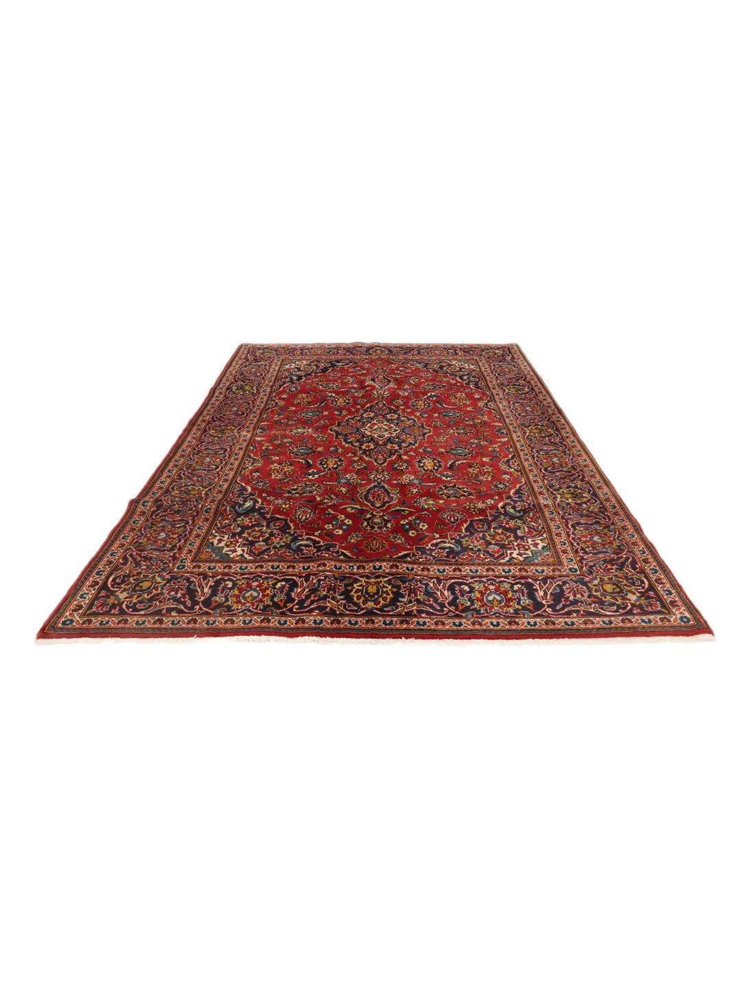 A hand-knotted Keshan rug in red and blue tones from the Middle East.