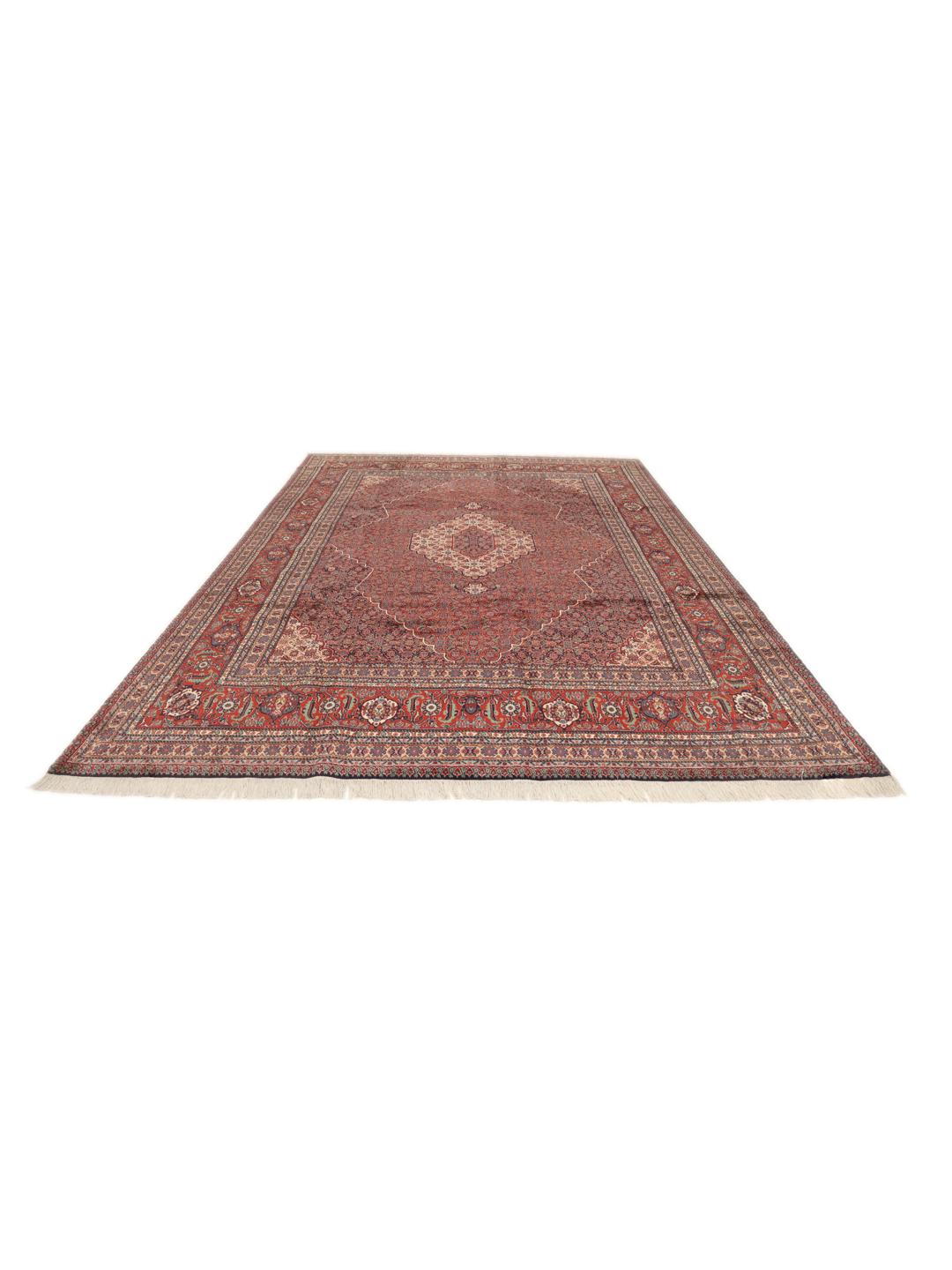 A large Moud rug from the Middle East featuring a dark-red field with a central medallion.