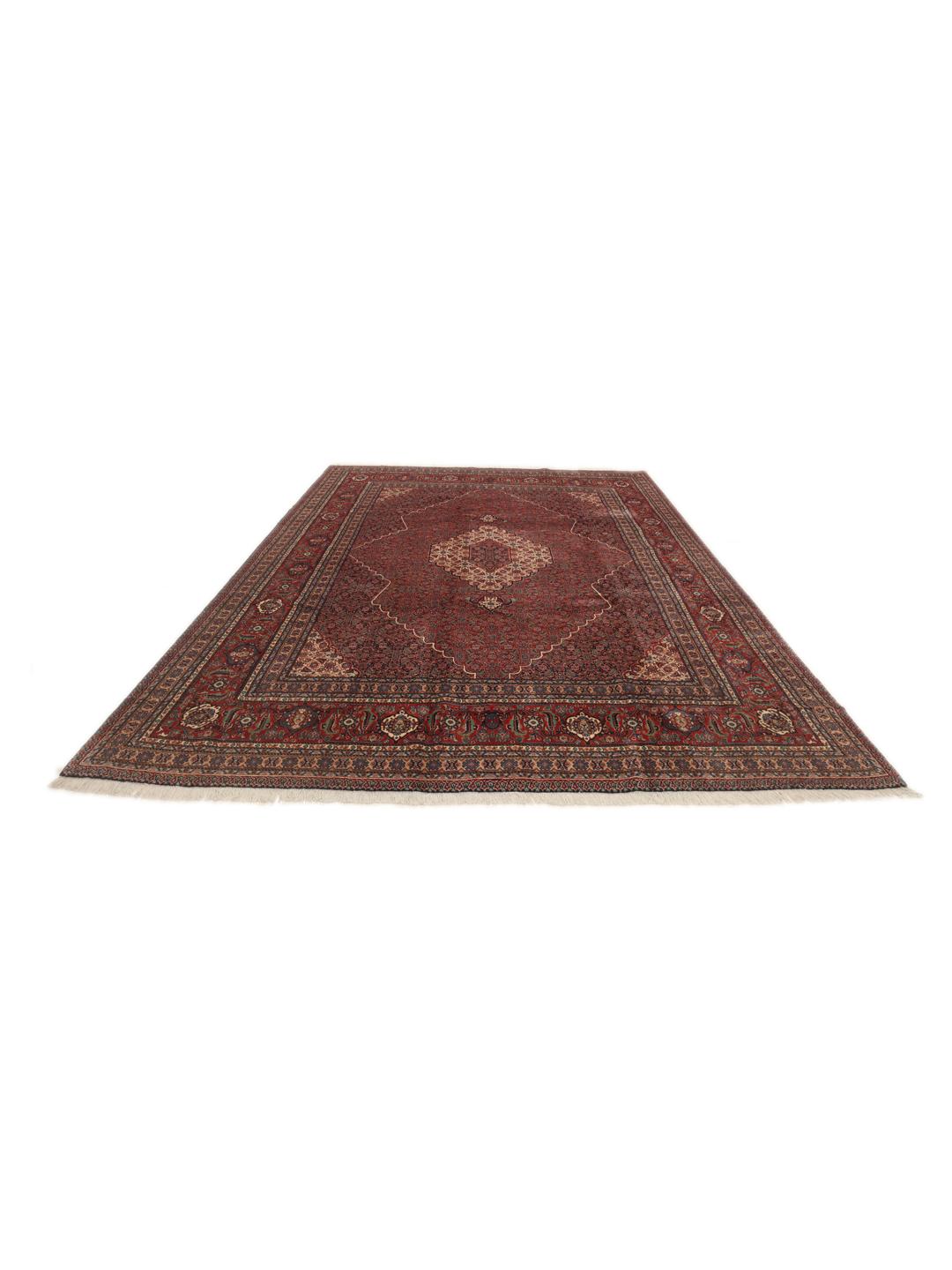 A large Moud rug from the Middle East featuring a dark-red field with a central medallion.