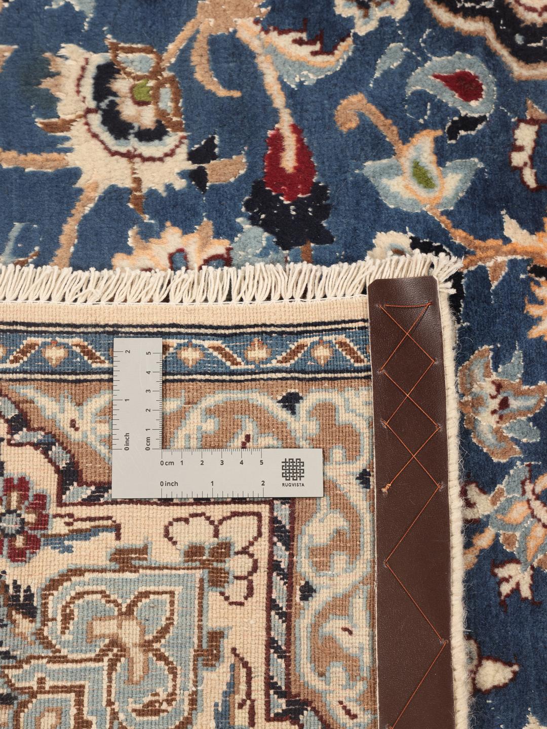 Hand-knotted Nain Fine 9La rug with a central medallion and floral motifs in blue and cream