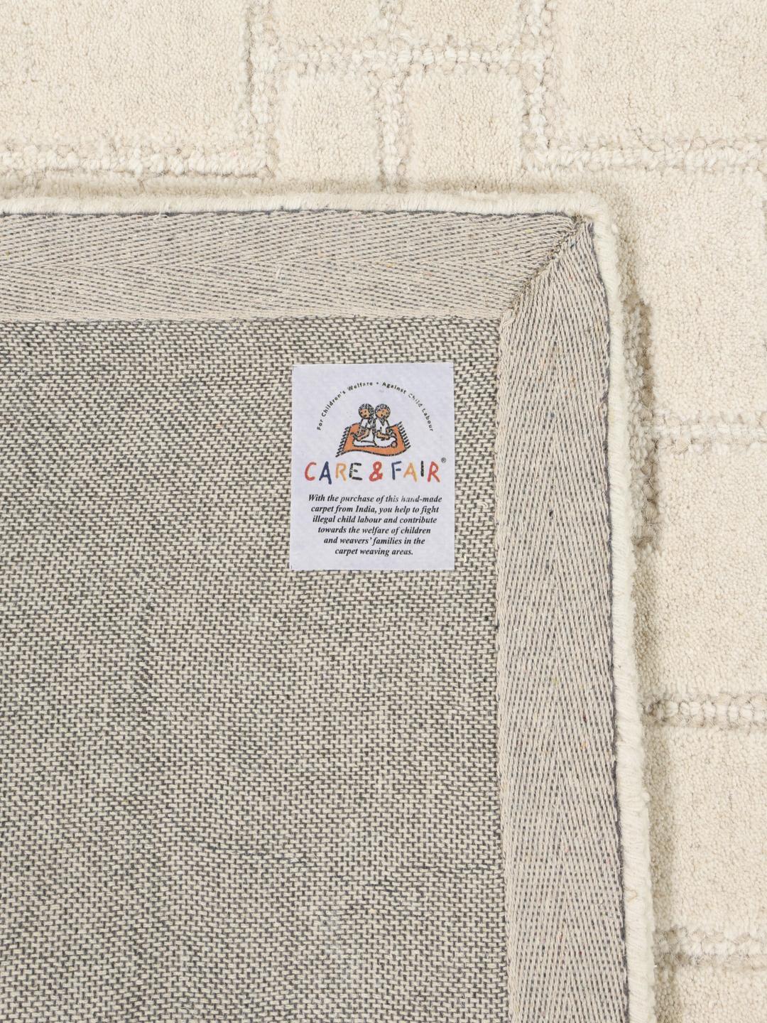 Beige wollen vloerkleed met geometrisch patroon