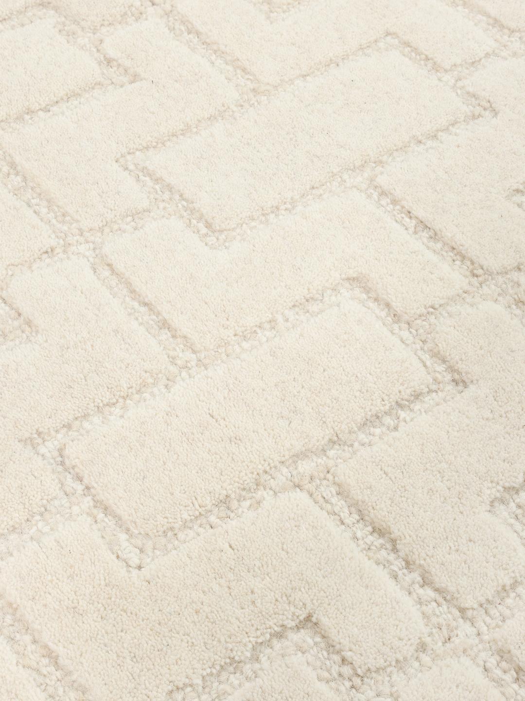Beige wollen vloerkleed met geometrisch patroon