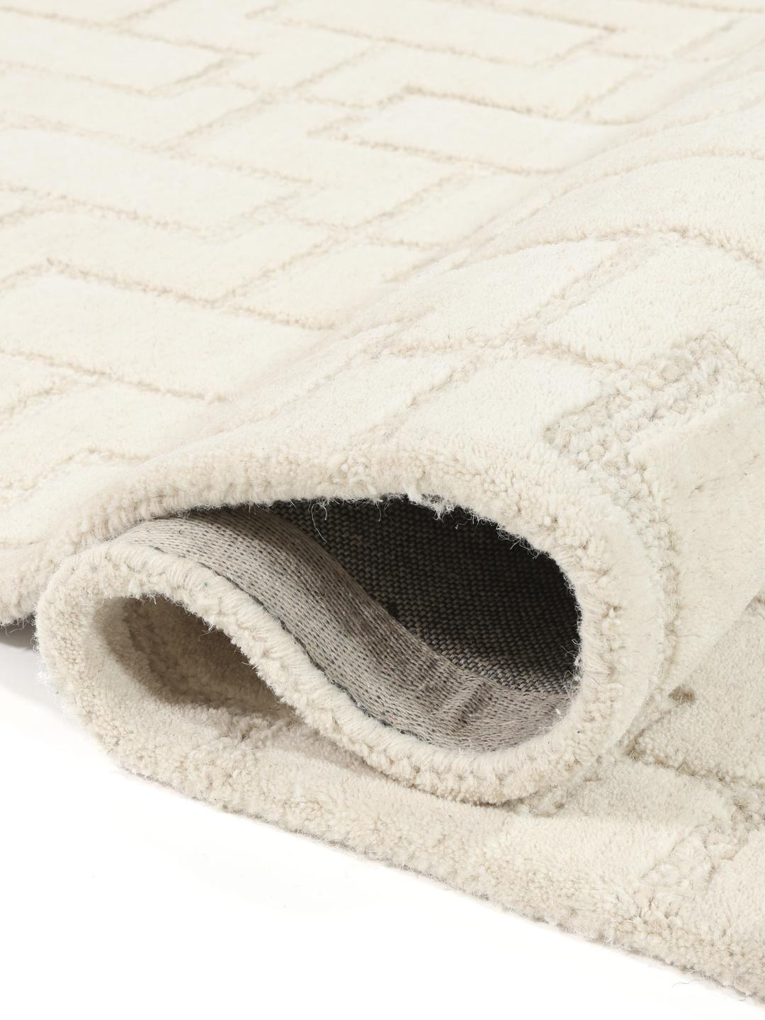 Beige wollen vloerkleed met geometrisch patroon