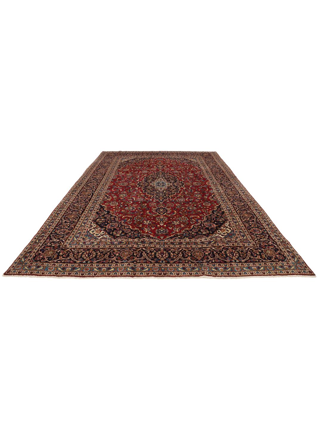 A hand-knotted Keshan rug from the Middle East in deep red and blue tones
