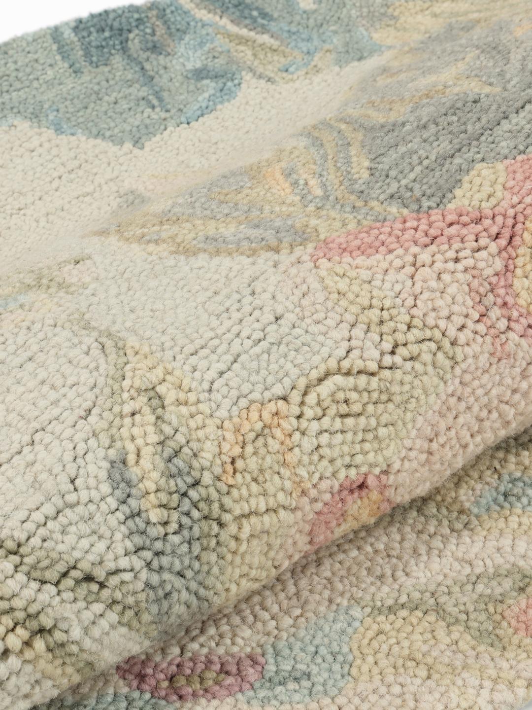 Beige rond vloerkleed met bloemenpatroon