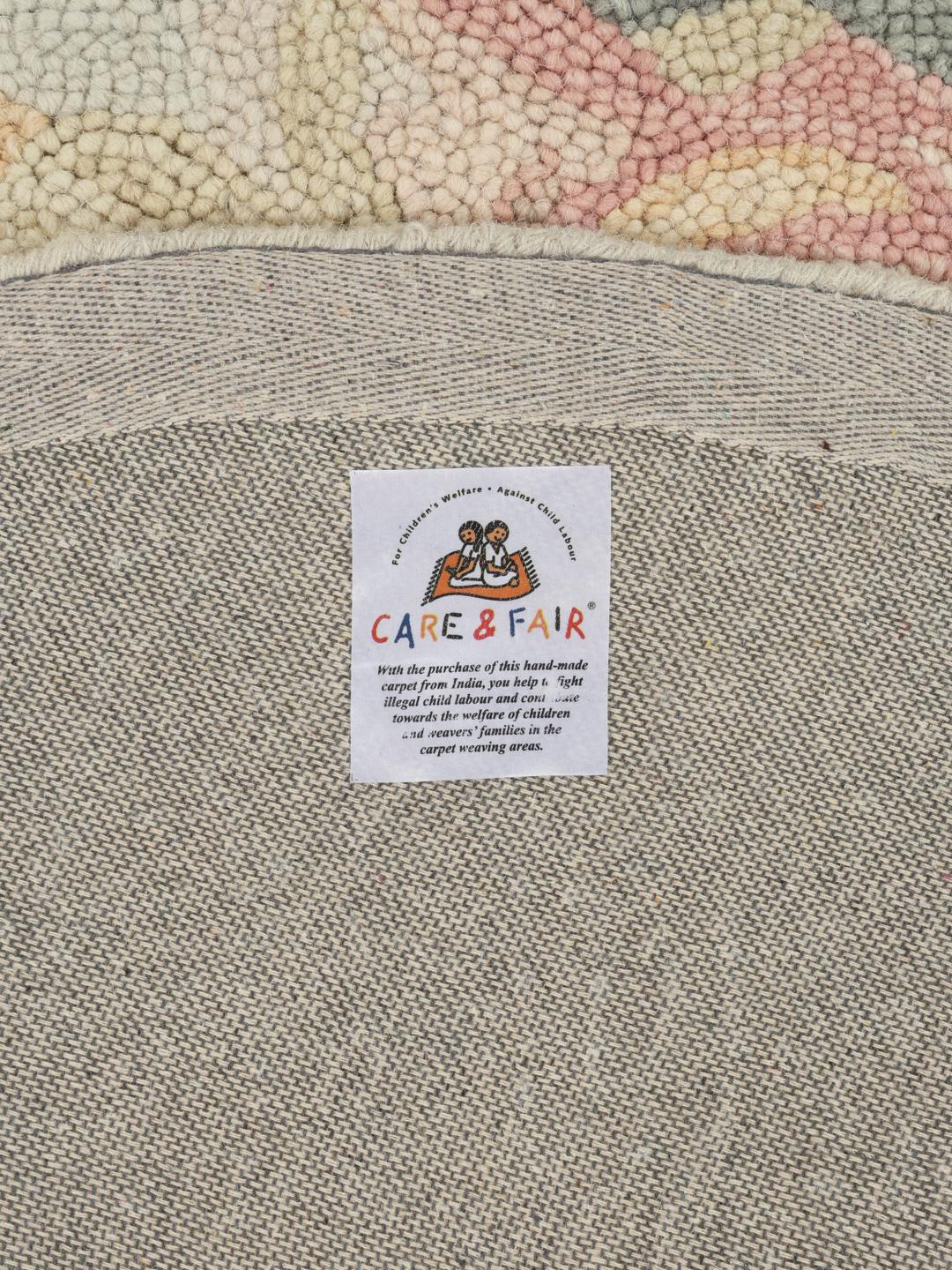 Beige rond vloerkleed met bloemenpatroon