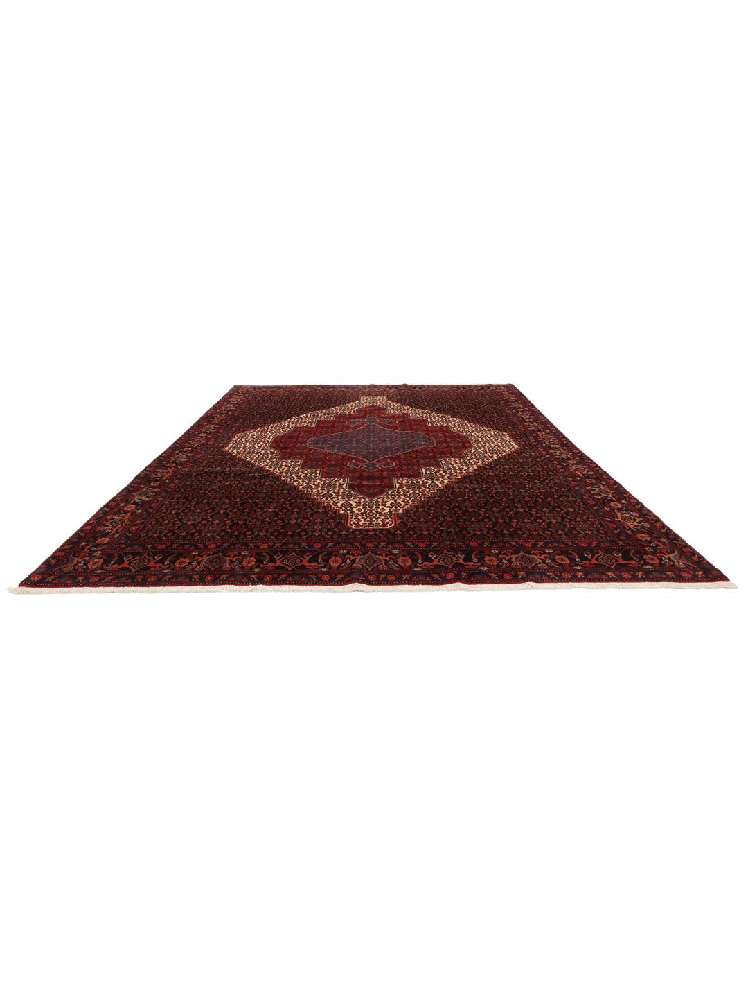 A hand-knotted Senneh rug from the Middle East featuring a dark-red and blue medallion design.