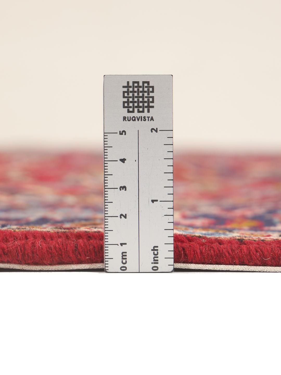 Hand-knotted Keshan rug from the Middle East in red and dark blue