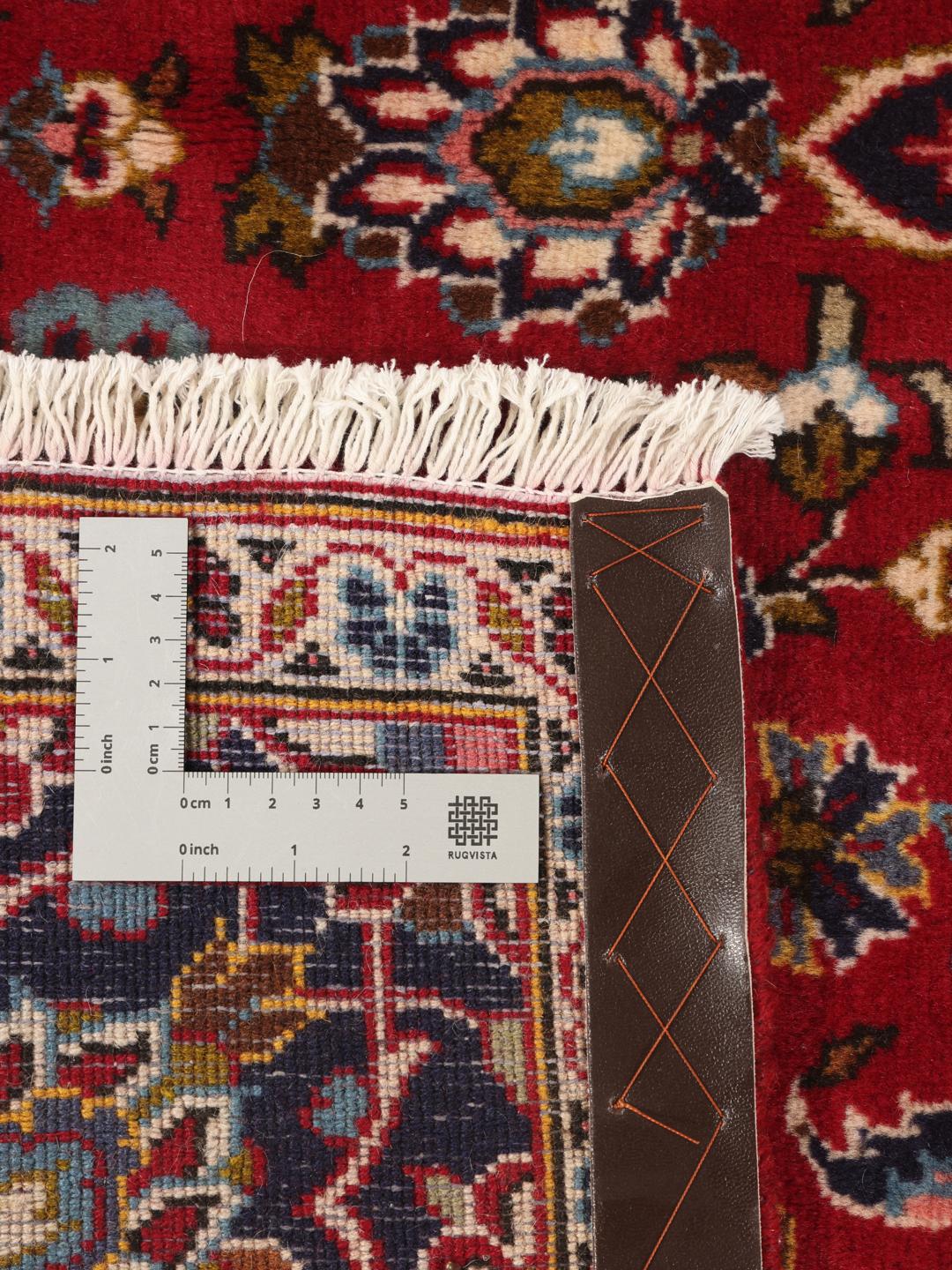 Hand-knotted Keshan rug from the Middle East in red and dark blue