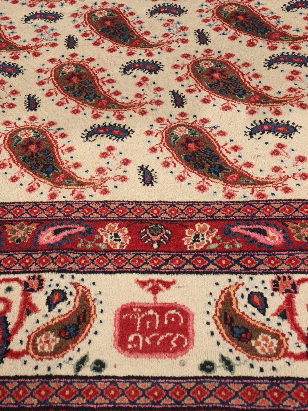 Hand-knotted Moud rug from the Middle East featuring a red and beige floral pattern