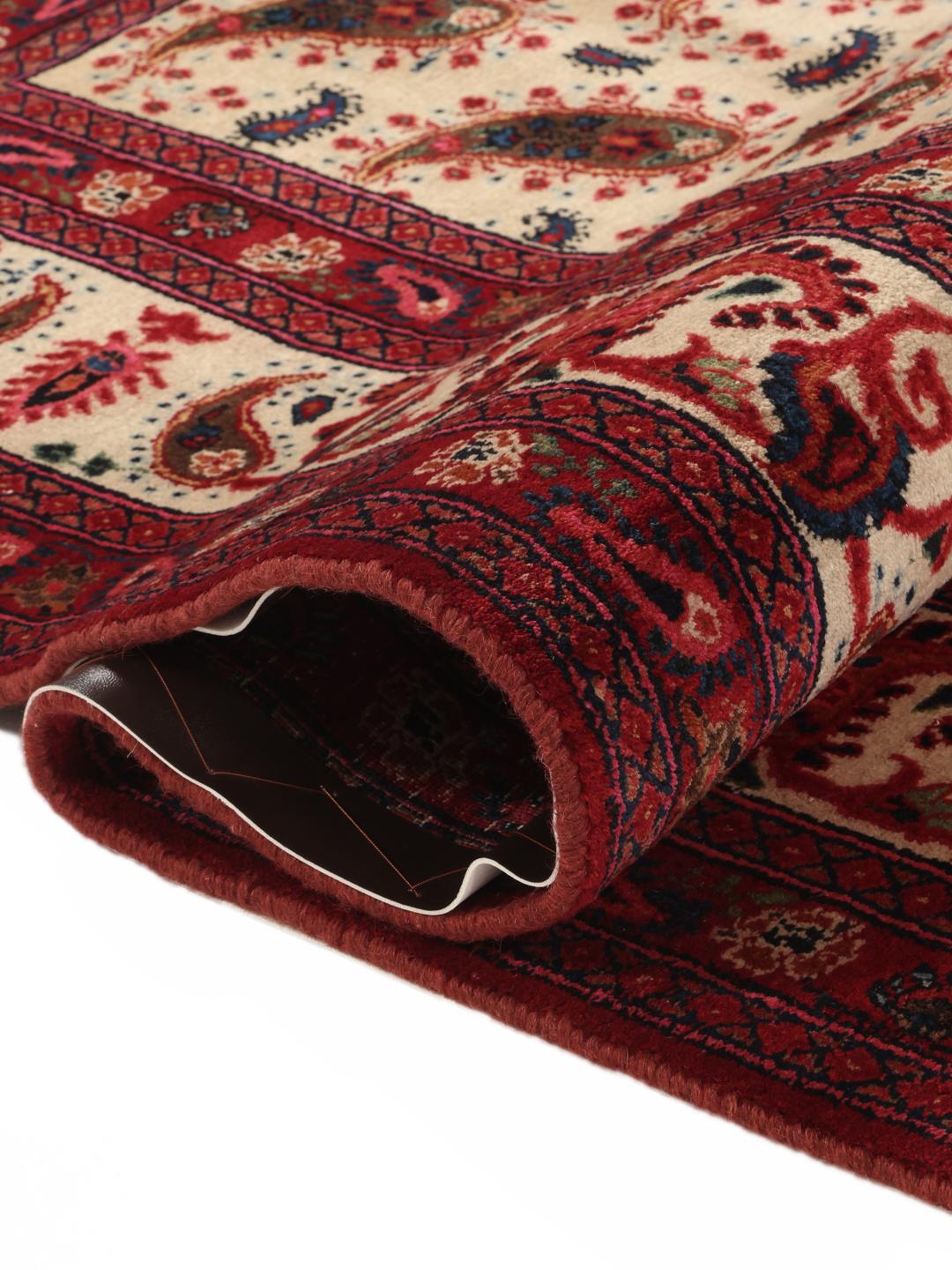 Hand-knotted Moud rug from the Middle East featuring a red and beige floral pattern