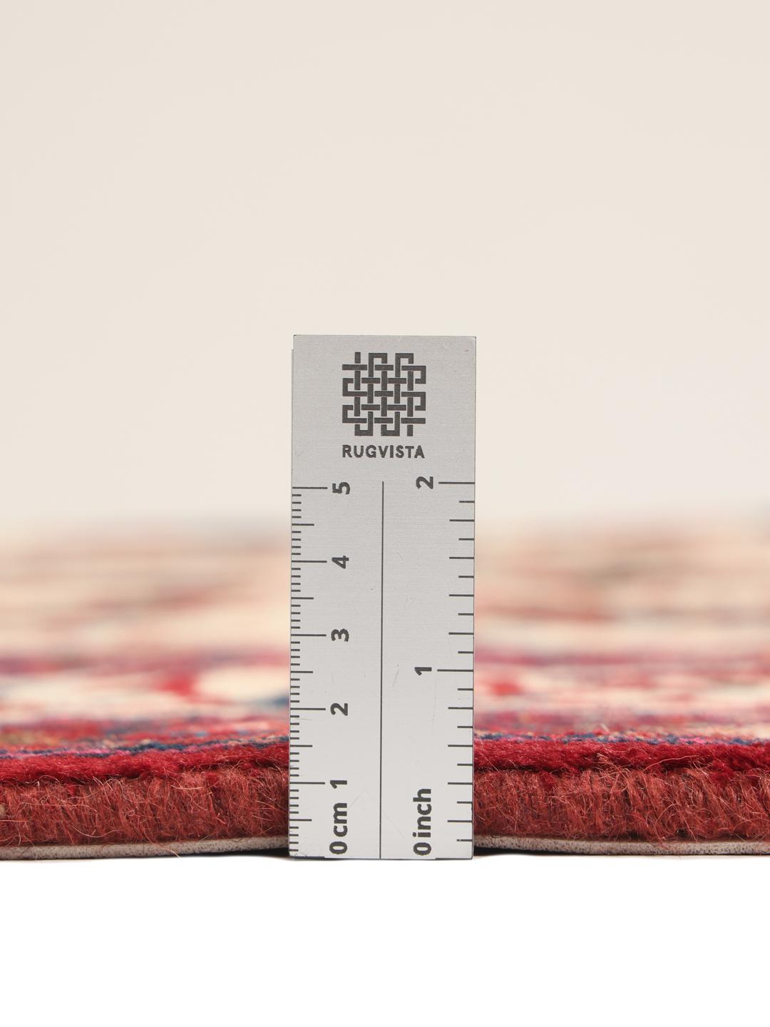 Hand-knotted Moud rug from the Middle East featuring a red and beige floral pattern