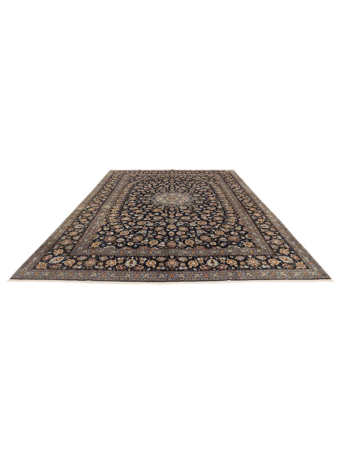 A large, hand-knotted Keshan rug from the Middle East in dark-blue with a central medallion.