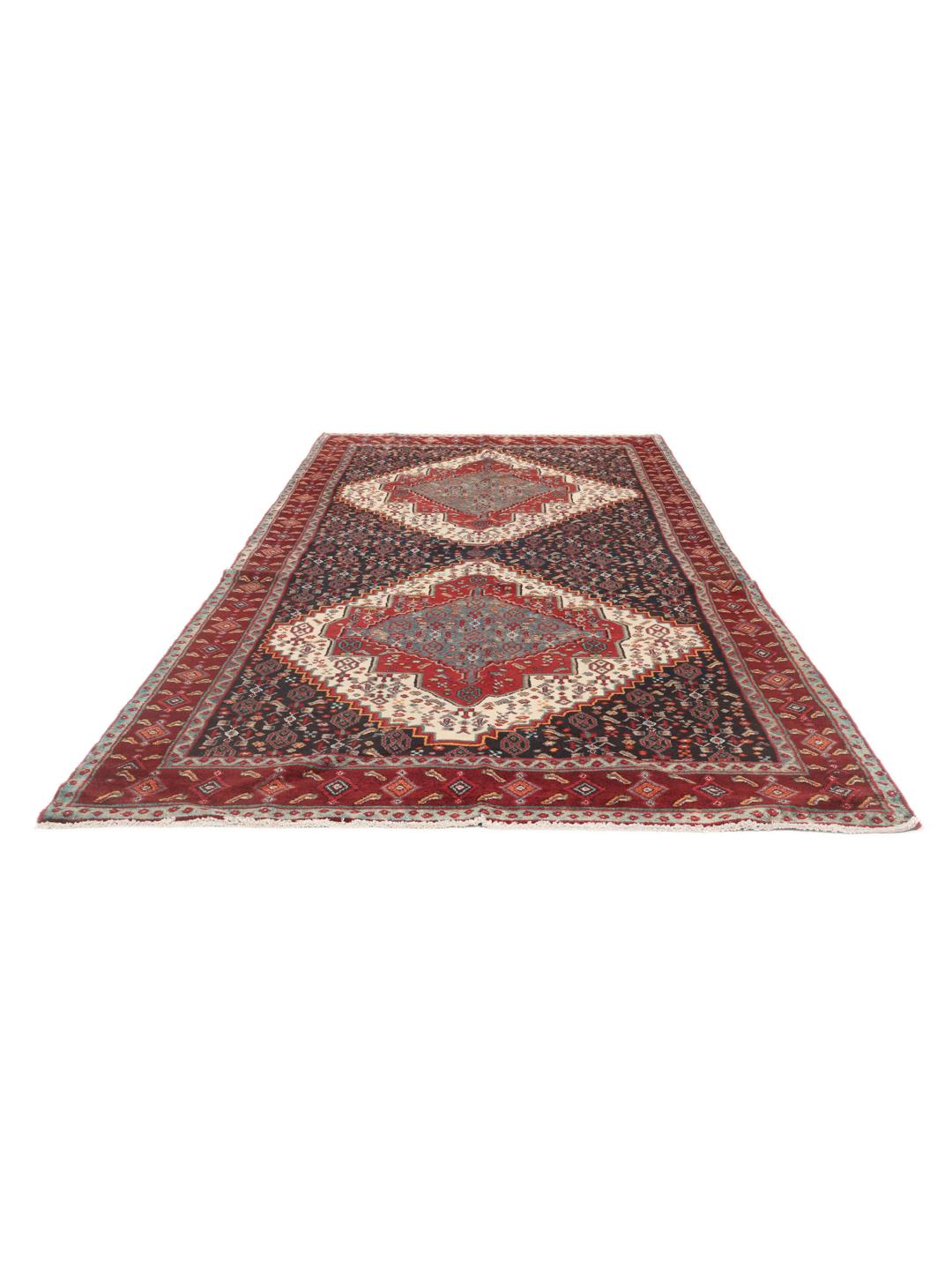 Hand-knotted Senneh runner with a dark multicolor medallion pattern