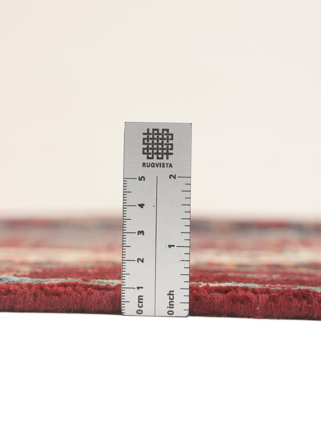 Hand-knotted Senneh runner with a dark multicolor medallion pattern