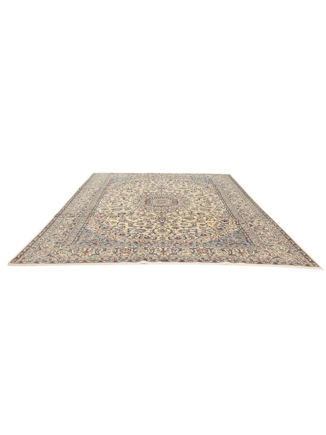 A large, rectangular Nain 9La rug with intricate blue and red floral patterns on a beige field, originating from the Middle East.