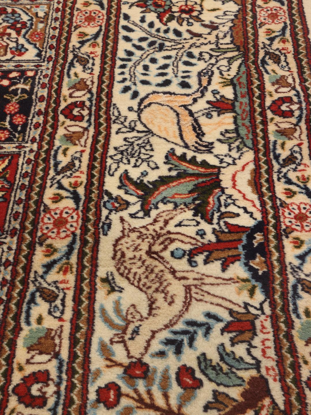 Hand knotted Moud rug from the Middle East featuring a multicolor grid pattern with floral motifs