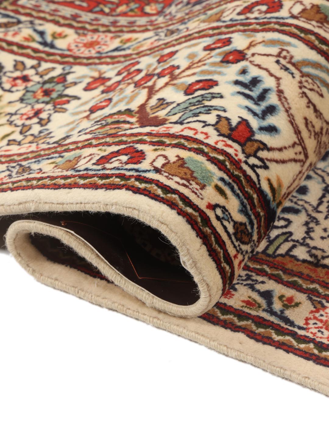 Hand knotted Moud rug from the Middle East featuring a multicolor grid pattern with floral motifs