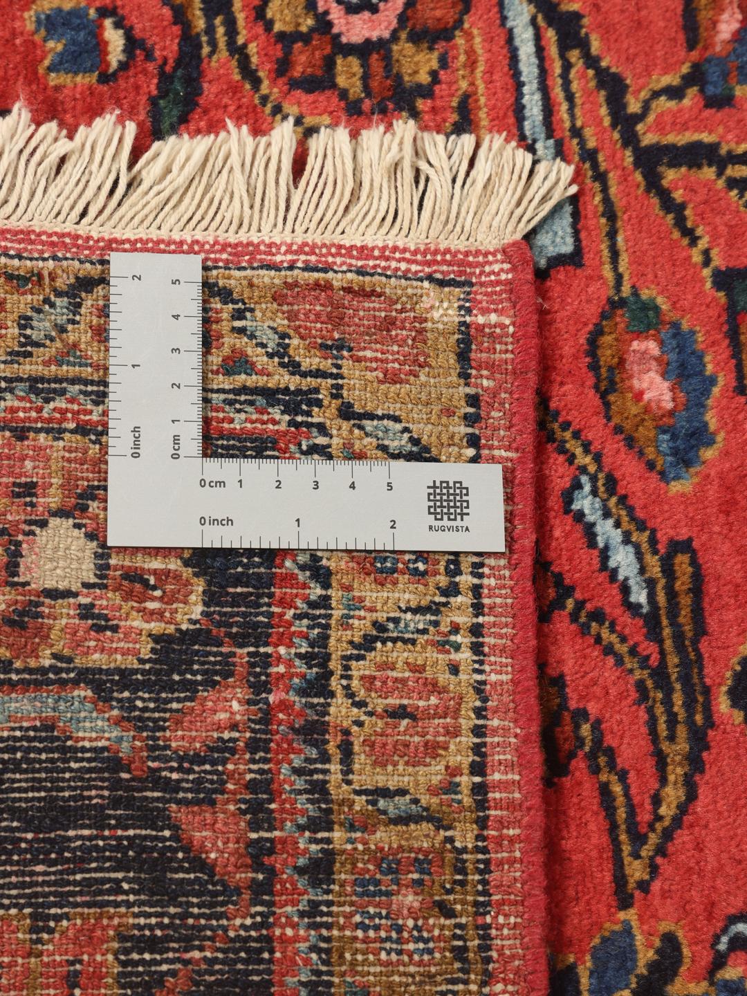 Handgeknoopt Lillian-tapijt met een rood veld en traditionele bloemmotieven uit het Midden-Oosten