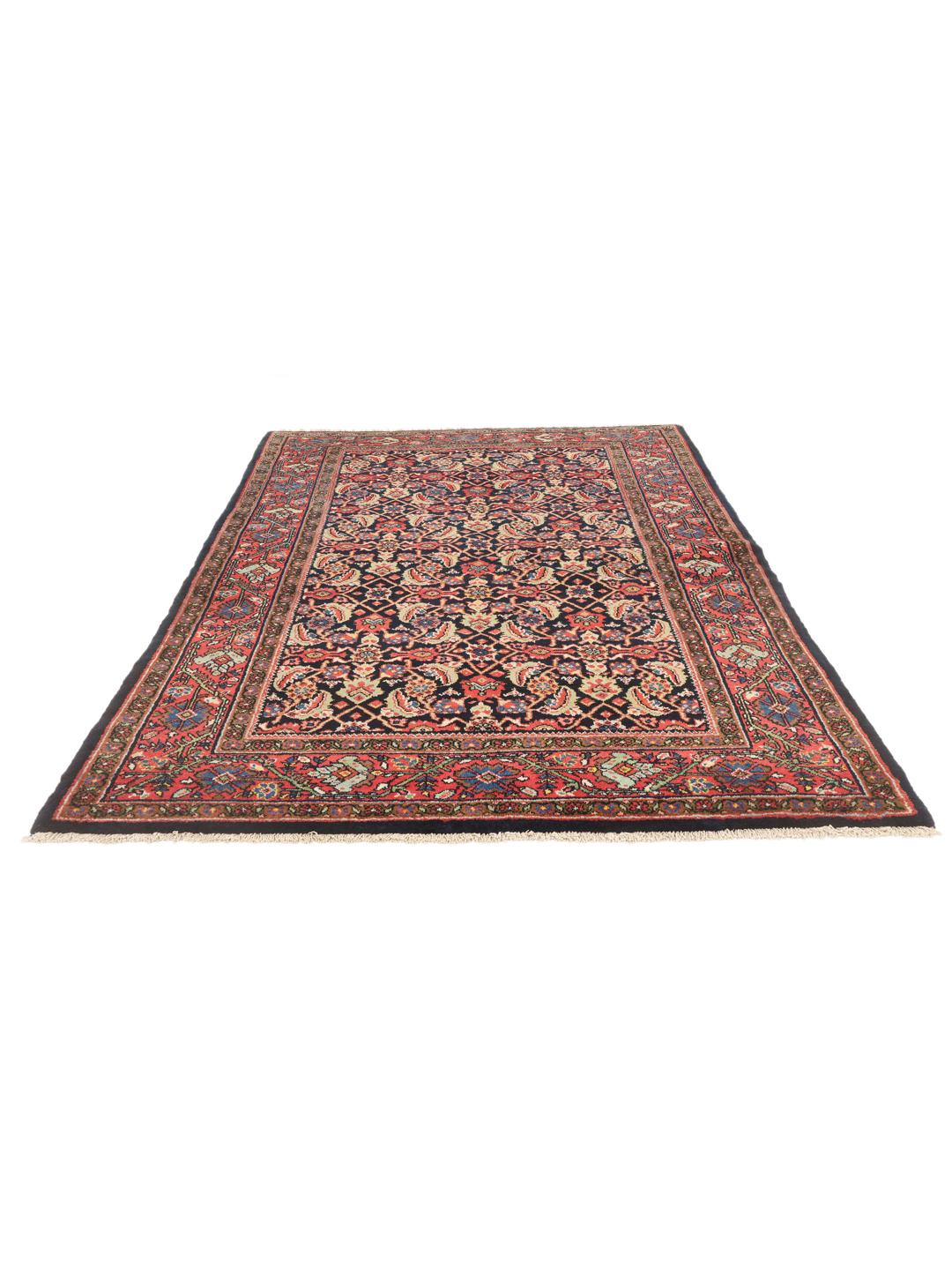 Hand-knotted Sarouk rug from the Middle East in dark-red and blue tones.