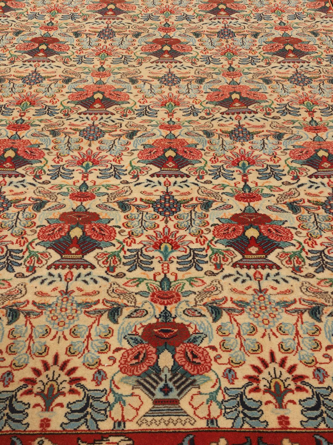 Hand-knotted Varamin rug with intricate floral patterns in red and beige from the Middle East