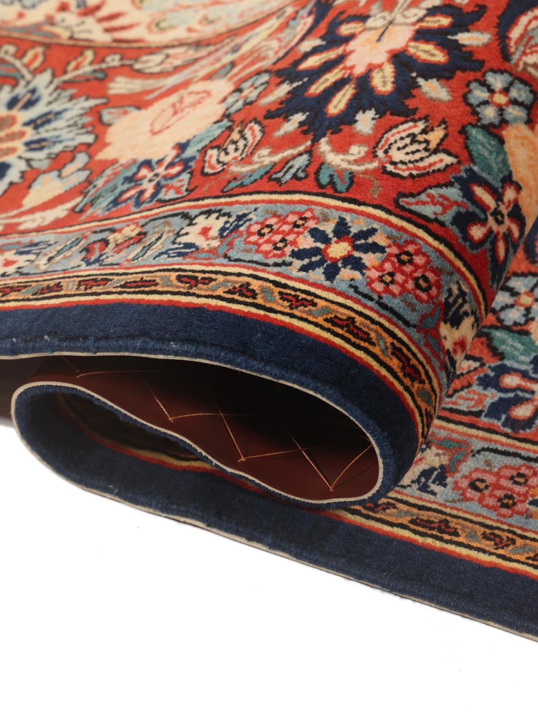 Hand-knotted Varamin rug with intricate floral patterns in red and beige from the Middle East