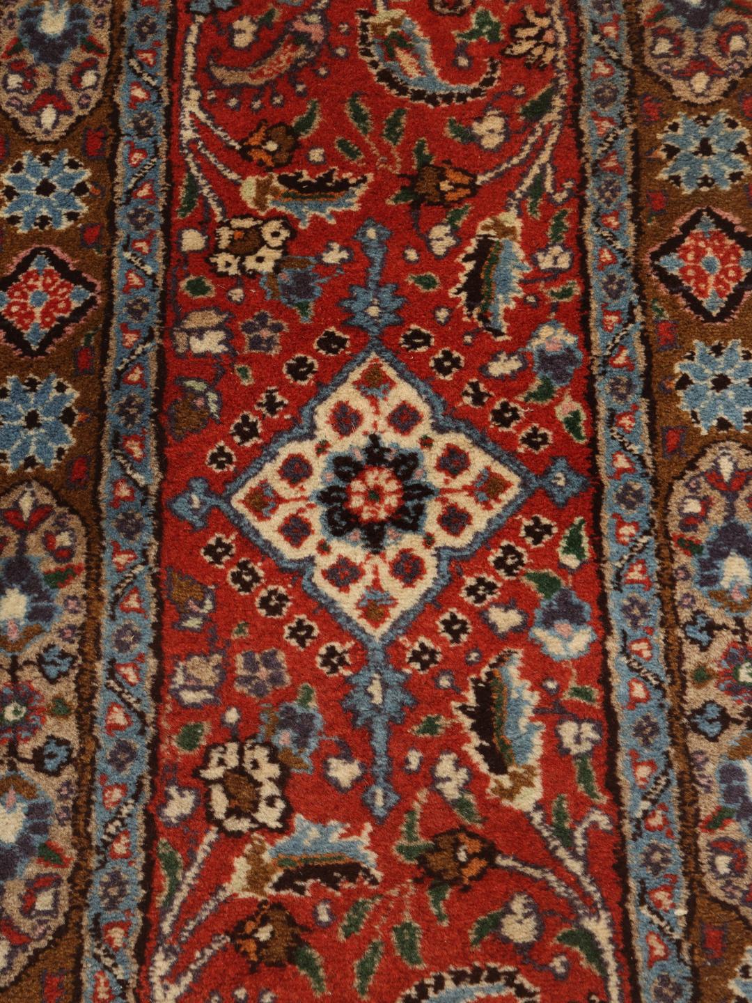 Handmade Moud rug with a central medallion in dark-red and beige tones