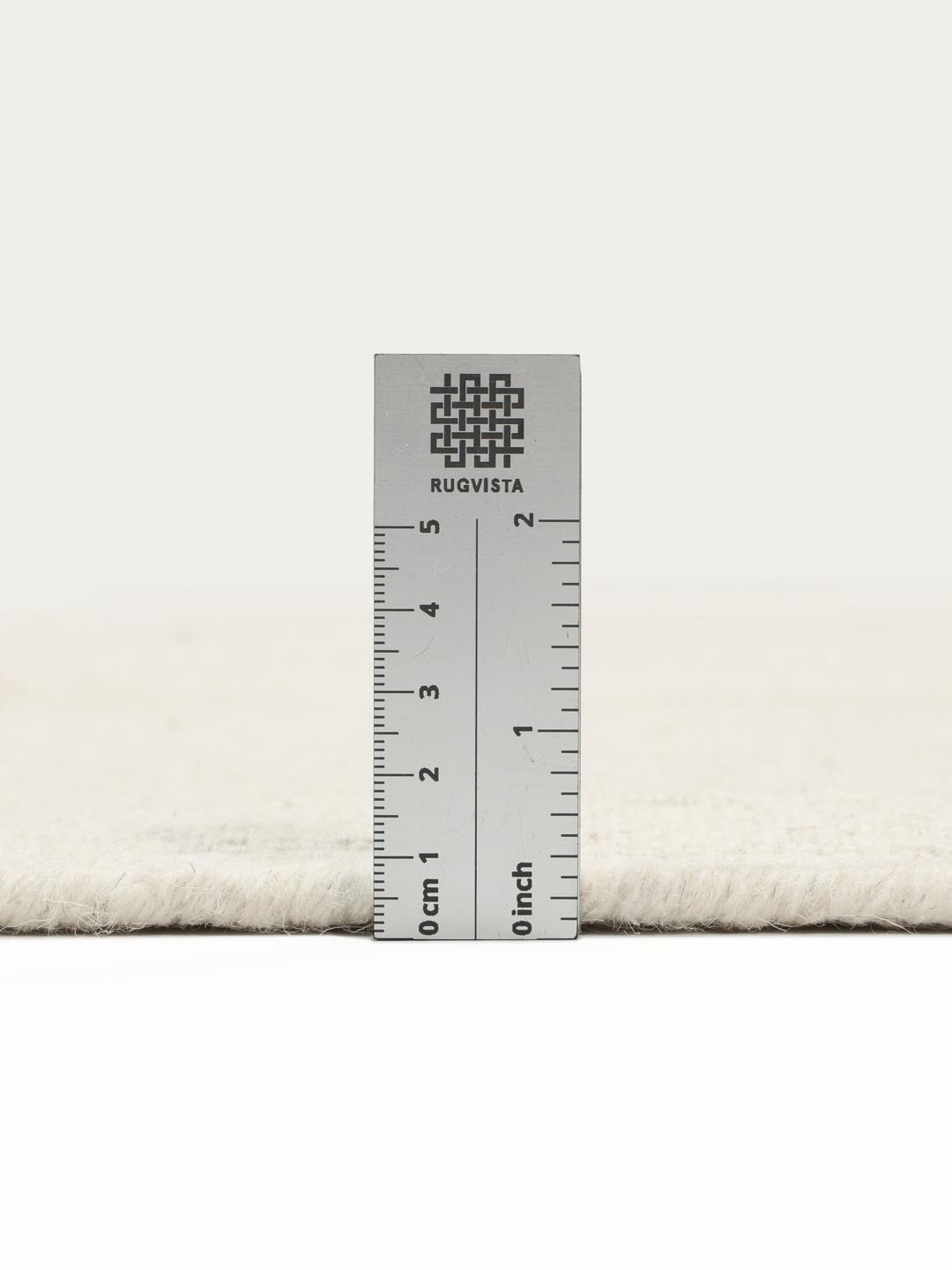 Råhvidt håndvævet uldtæppe