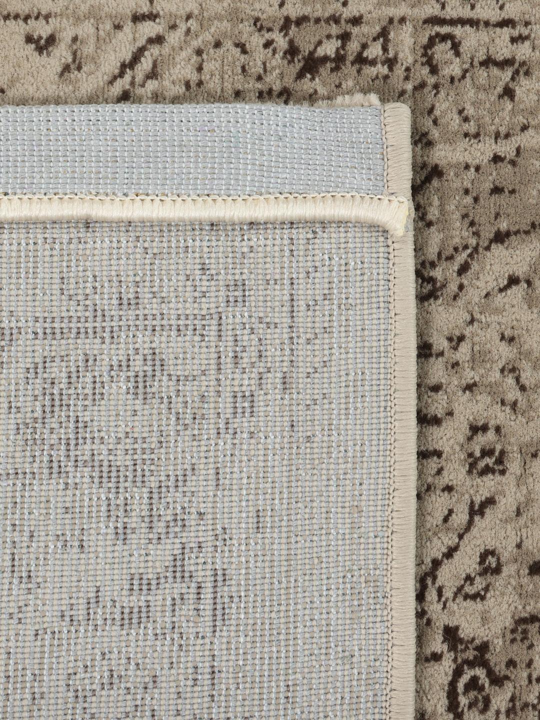 Beige vloerkleed met laagpolig oppervlak