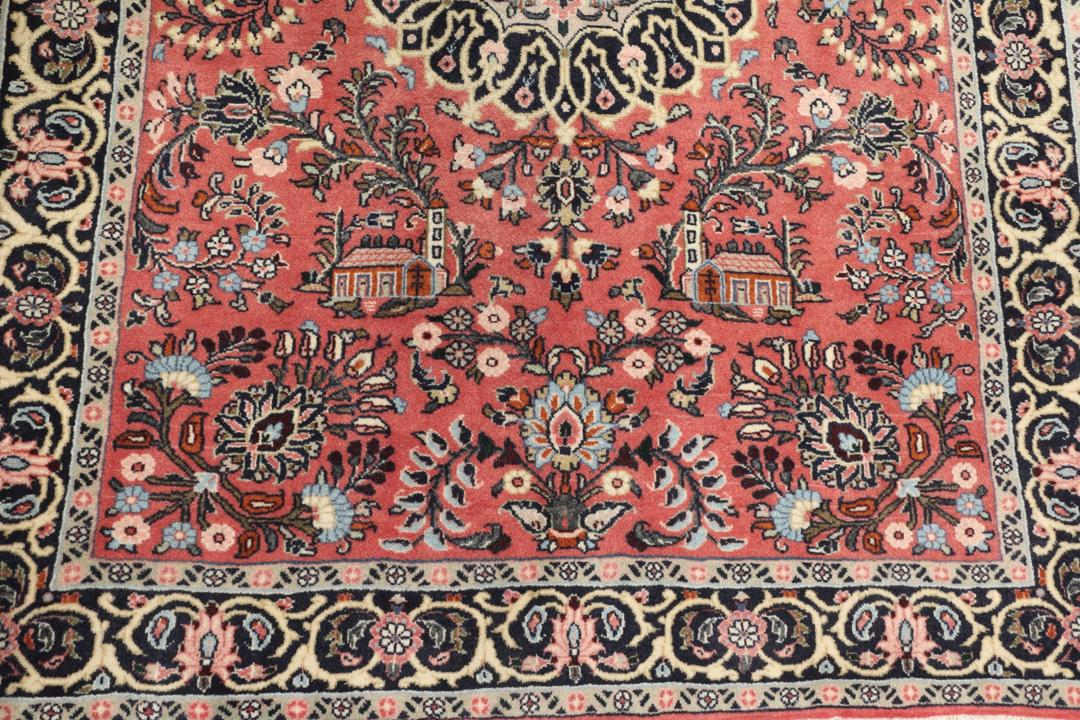 Et håndknyttet Hamadan Shahrbaf-tæppe fra Mellemøsten i mørkerøde nuancer med blomstermotiver.