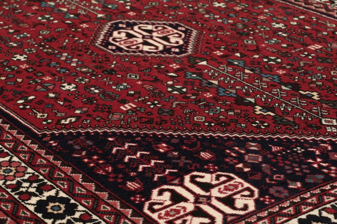 Håndknyttet Abadeh-tæppe med et rødt og blåt blomstermedallion-design fra Mellemøsten