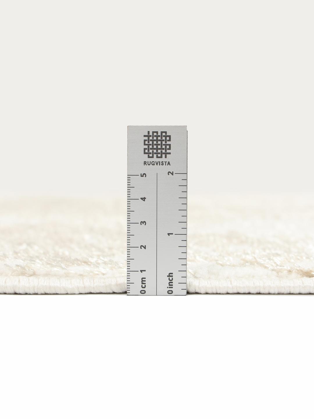 Rond vloerkleed in wit en beige