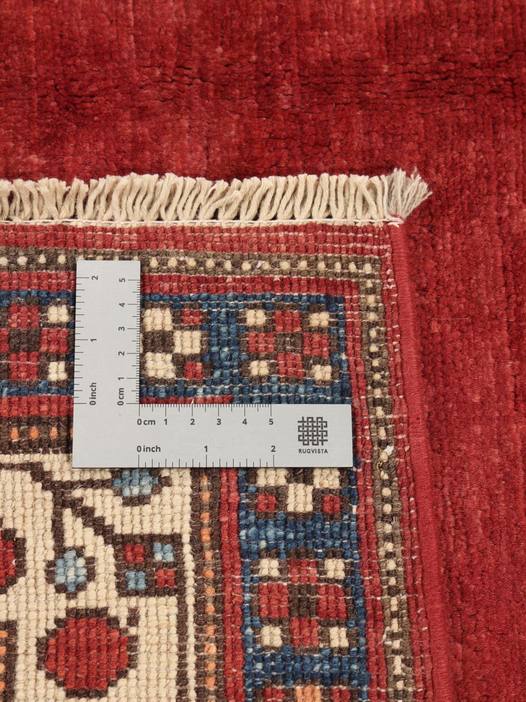 Handgefertigter afghanischer Kazak-Teppich in Rot und Blau mit traditionellen geometrischen Motiven.