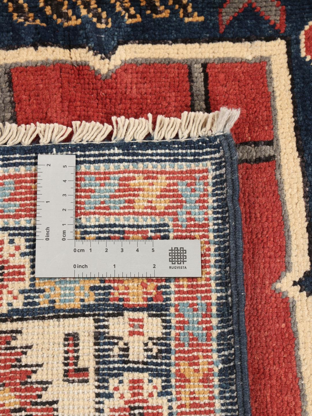 Tapis Kazak noué à la main originaire d'Afghanistan présentant un motif géométrique multicolore vibrant