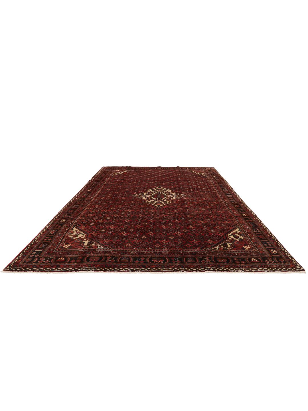 Hand-knotted Hosseinabad rug from the Middle East in deep red tones