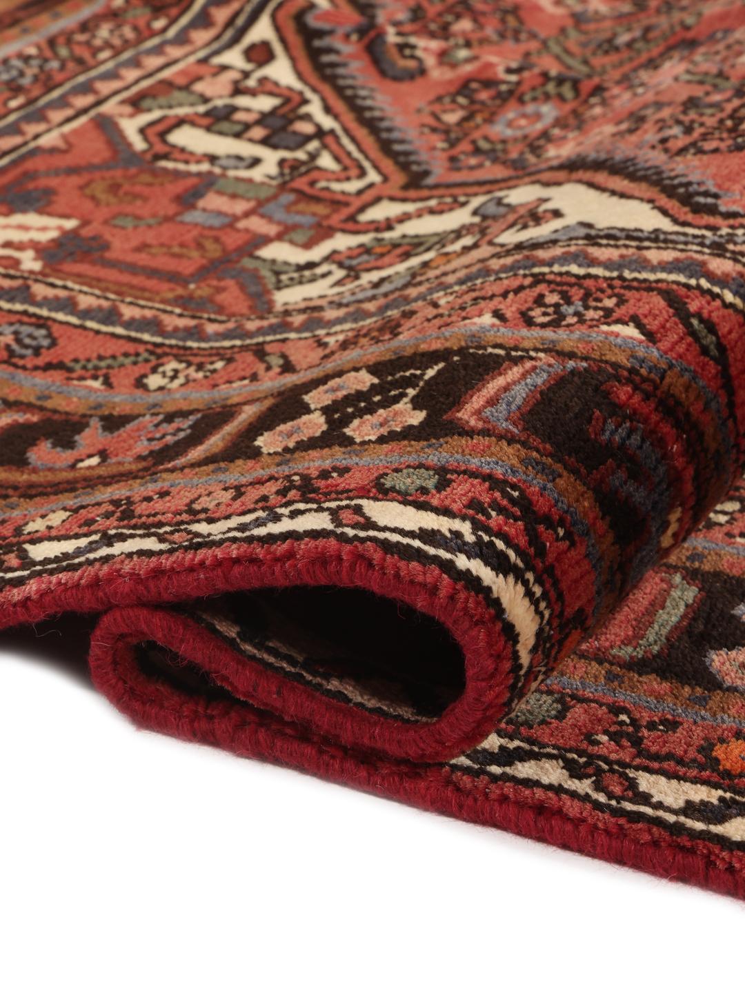Hand-knotted Hosseinabad rug from the Middle East in deep red tones
