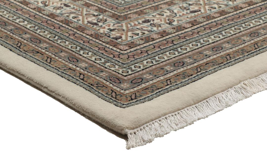 A large rectangular hand-knotted Sarouk Mir rug from India in shades of brown and beige.