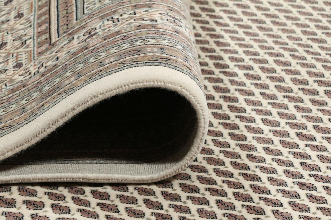 A large rectangular hand-knotted Sarouk Mir rug from India in shades of brown and beige.