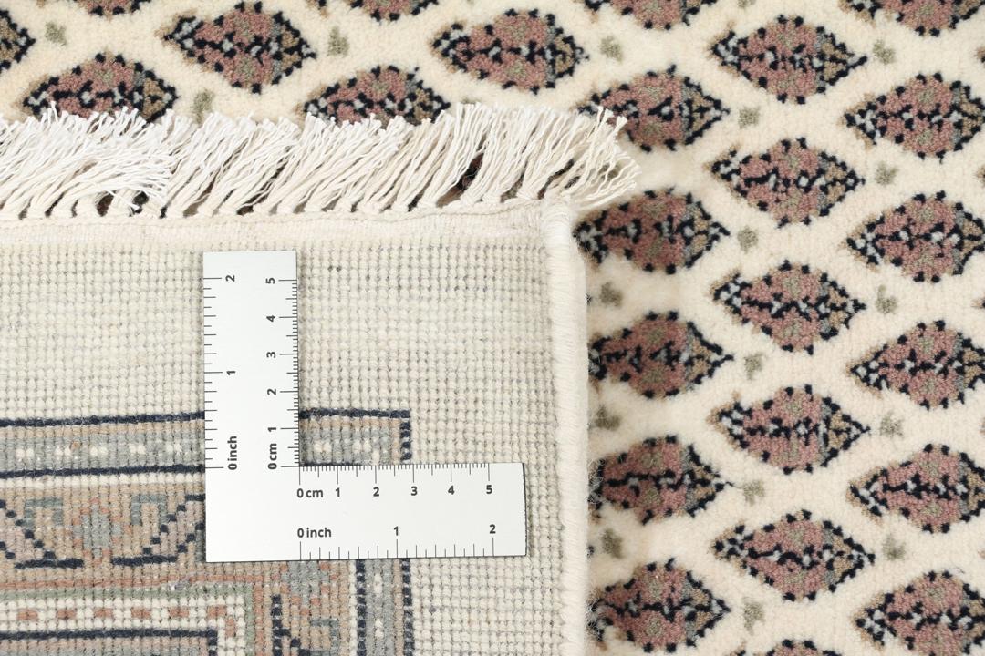 A large rectangular hand-knotted Sarouk Mir rug from India in shades of brown and beige.