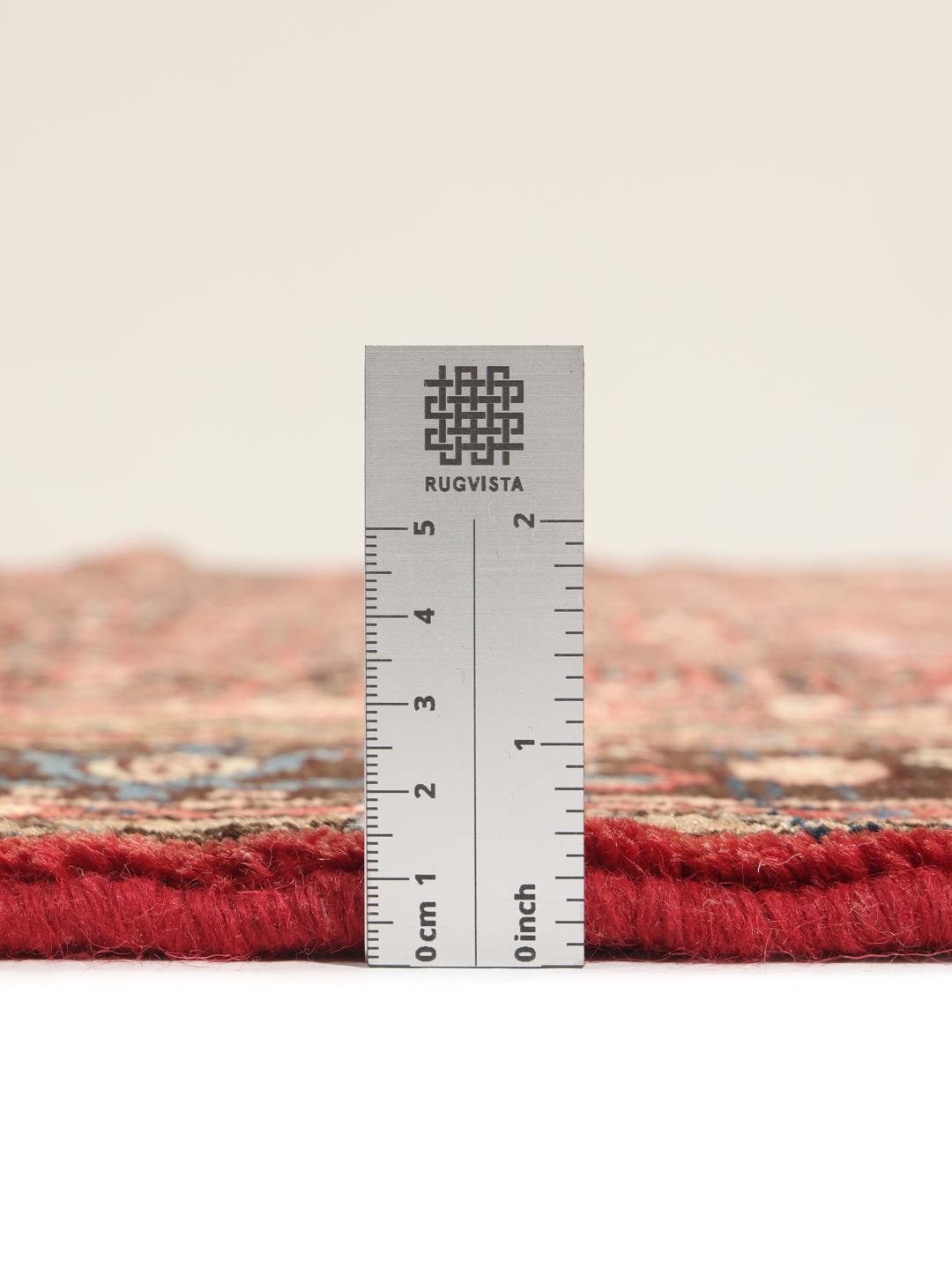 Hand-knotted Hosseinabad rug from the Middle East in deep red and black