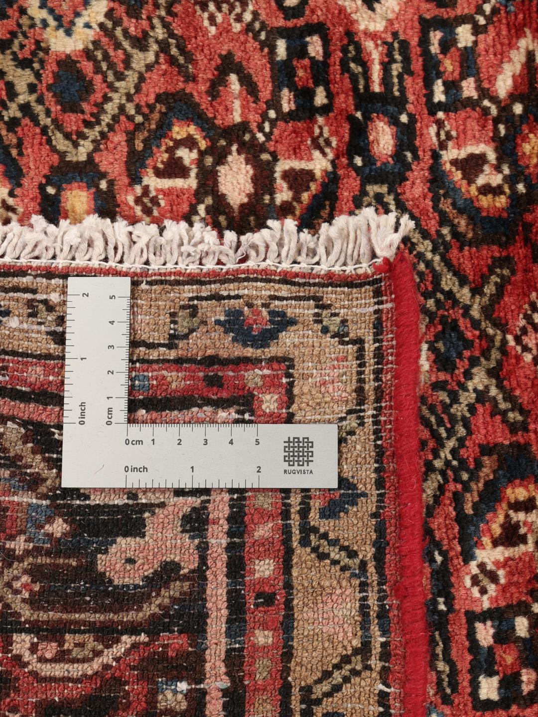 Hand-knotted Hosseinabad rug from the Middle East in deep red and black