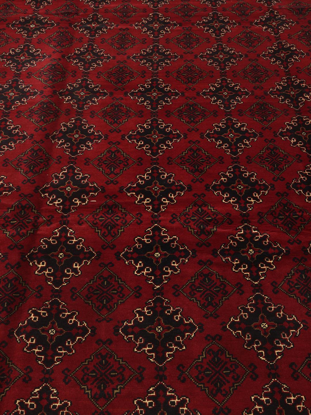 Hand-knotted Afghan Kunduz rug with red and black geometric patterns